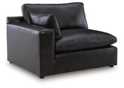 Ashley Furniture Emilia sectional sofa in a neutral fabric with chaise lounge and plush cushions