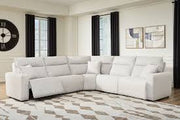 Ashley Furniture Modmax II power reclining sectional with plush fabric and built-in audio console, shown in a modern living room setting.